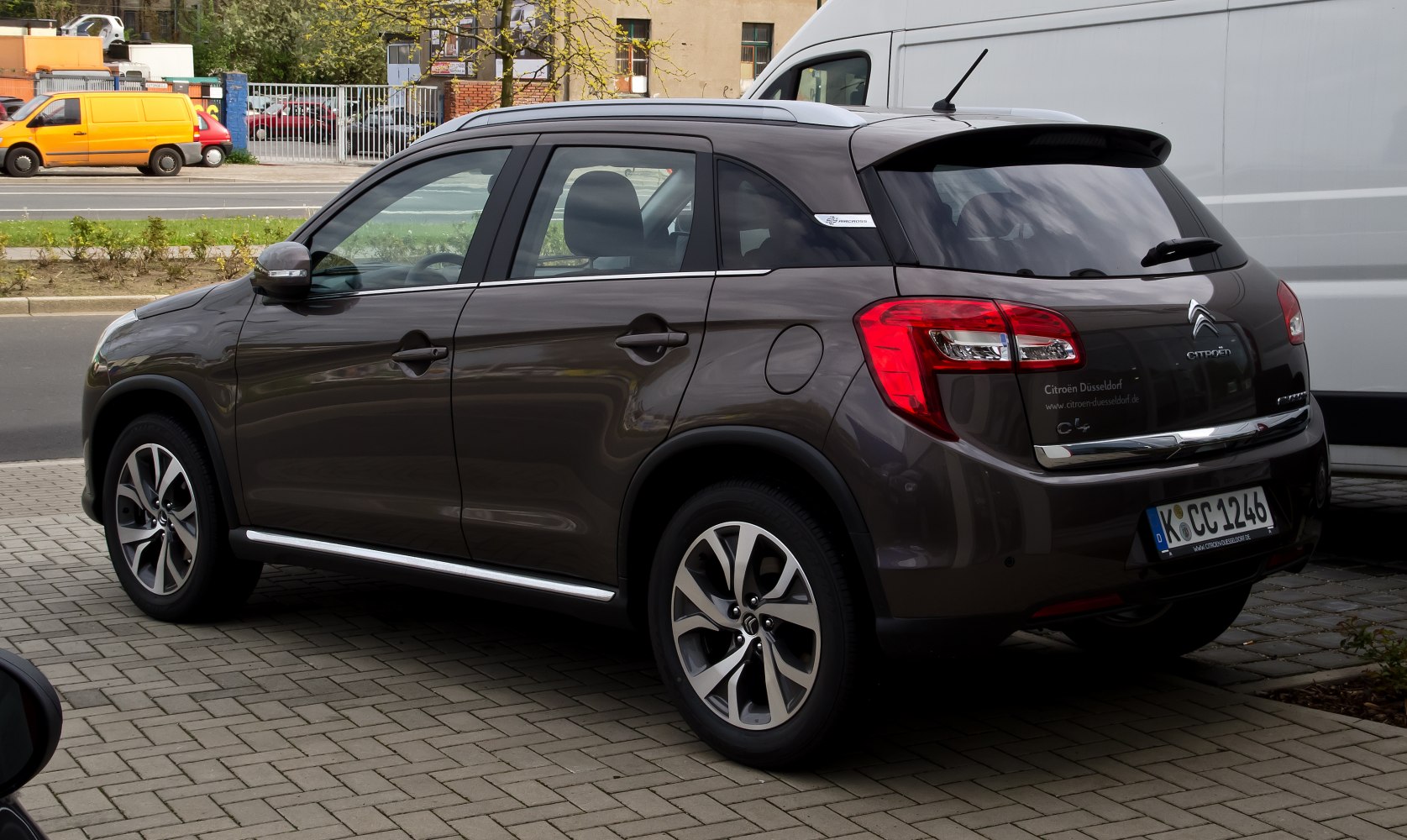 Rear side view of SUV with tail lights and alloy wheels