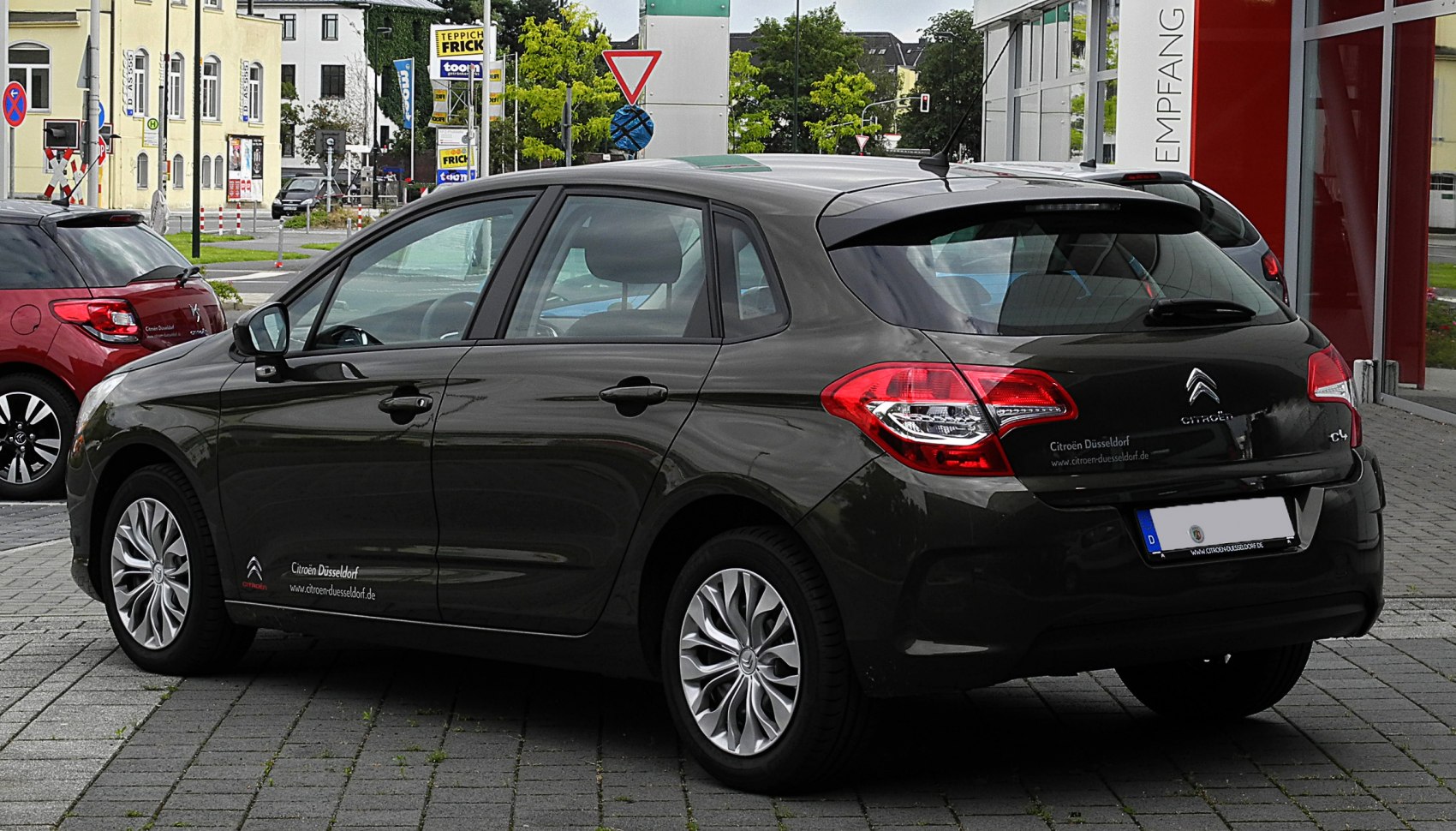 Rear side view with tail lights and alloy wheels