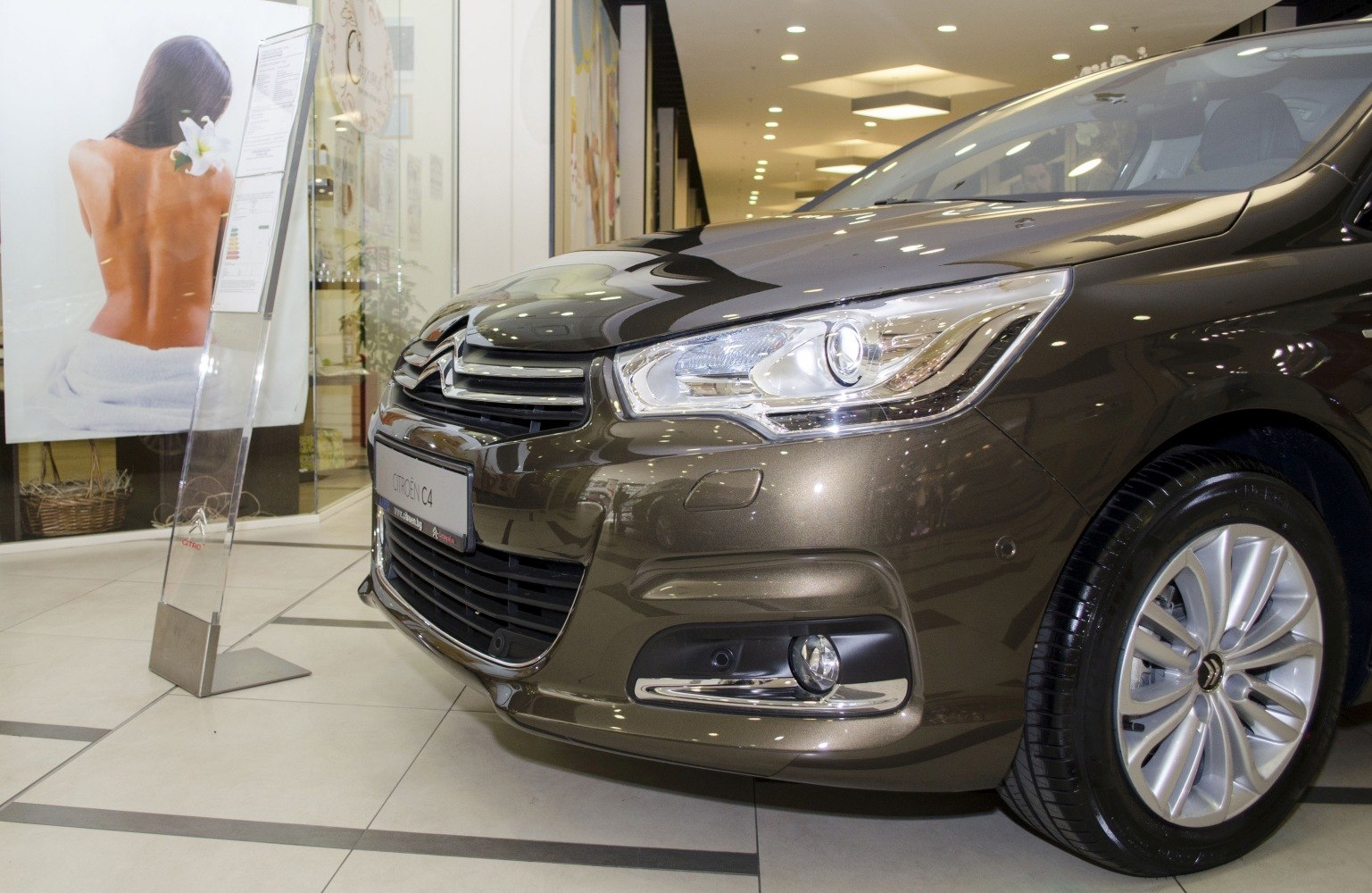 Close-up of hatchback front with headlight and wheel