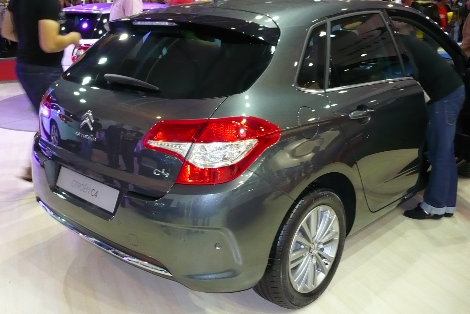 Rear view of grey compact hatchback with LED taillights and alloy wheels