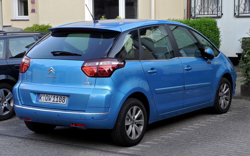 Rear side view of blue compact MPV with distinctive tail lights