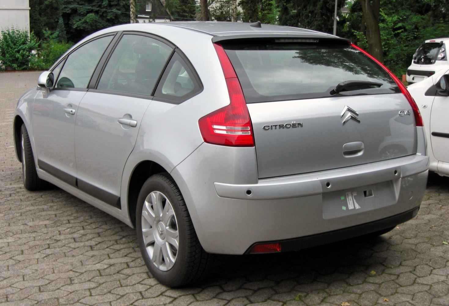 Silver hatchback with vertical tail lights and curved rear window