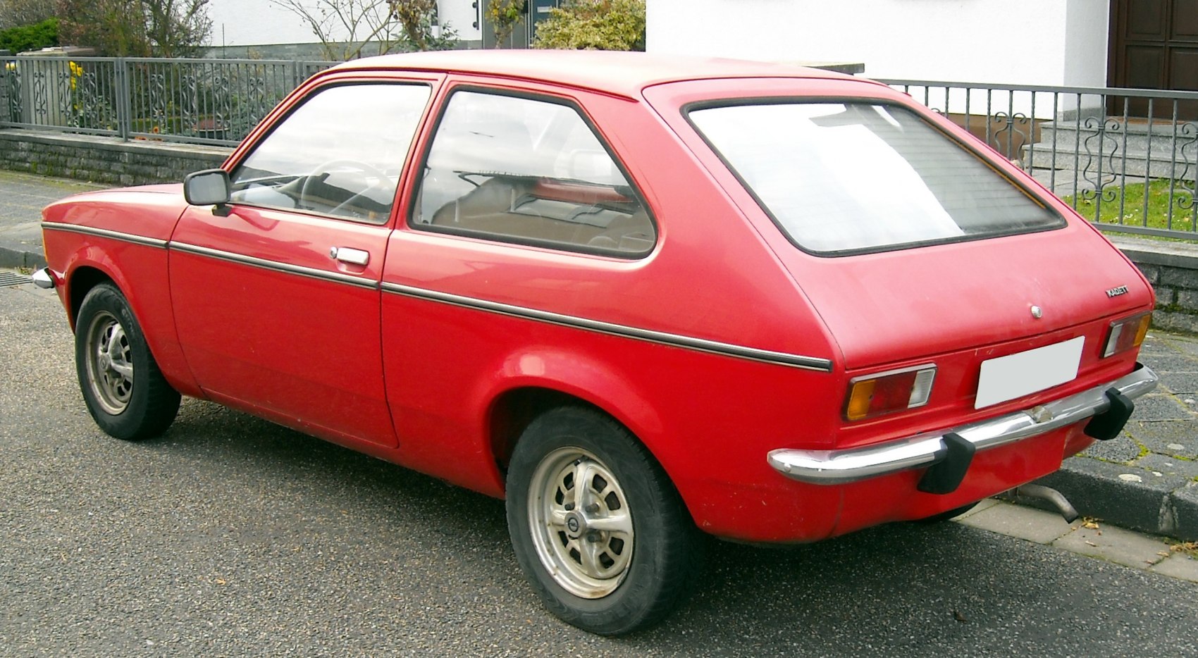 Vintage 1970s compact hatchback rear-side view with chrome bumper