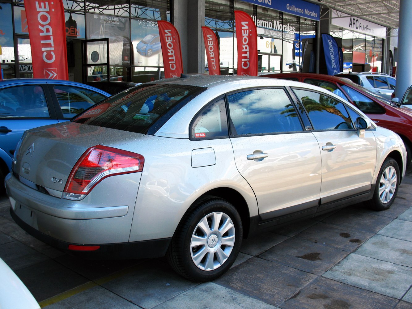Silver mid-size sedan rear side profile with distinctive taillights