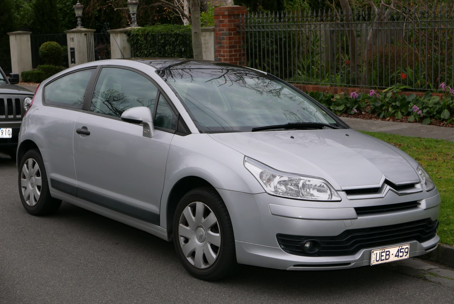 Silver hatchback with clear headlights and sleek roofline