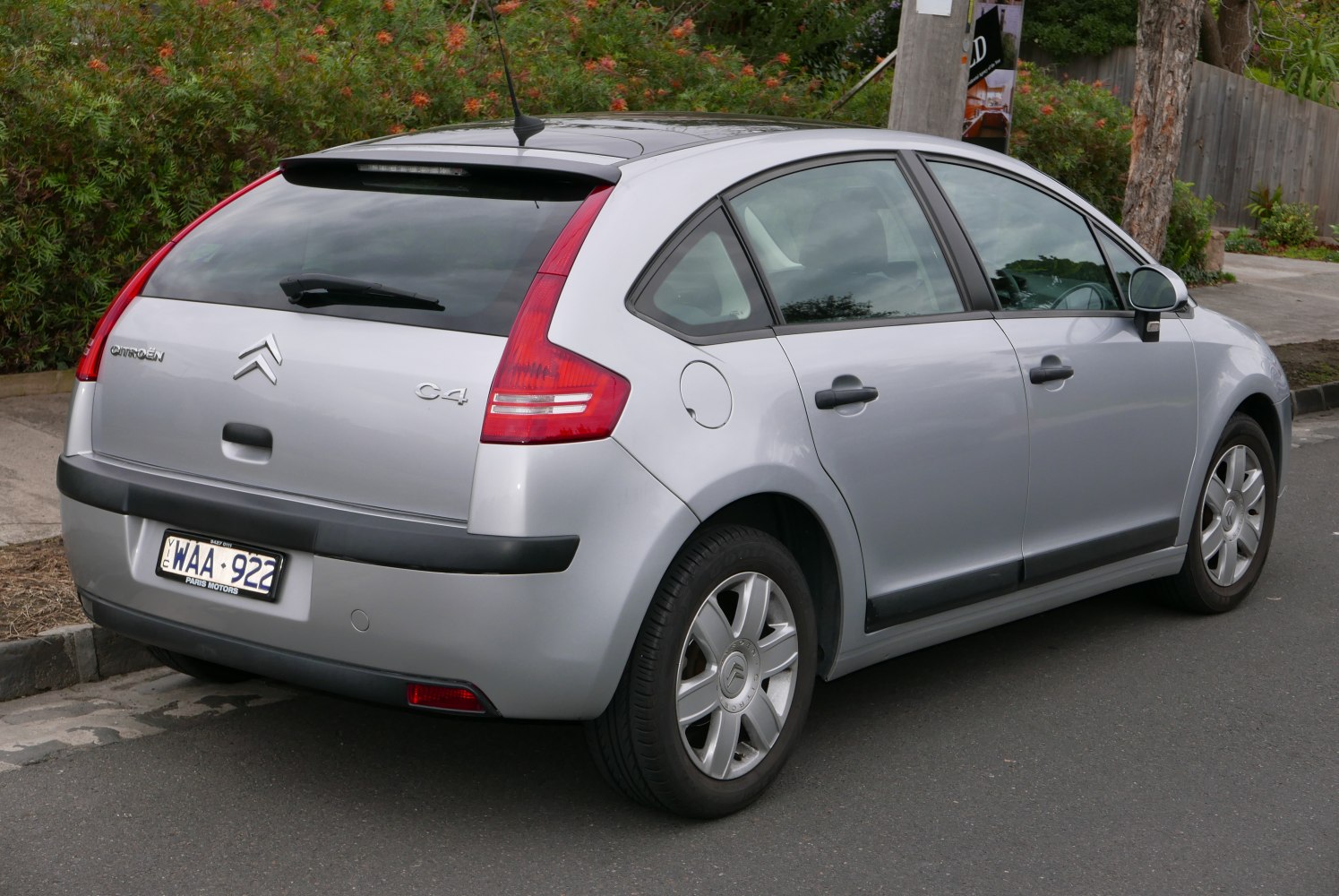 Silver hatchback rear with vertical tail lights and rear spoiler