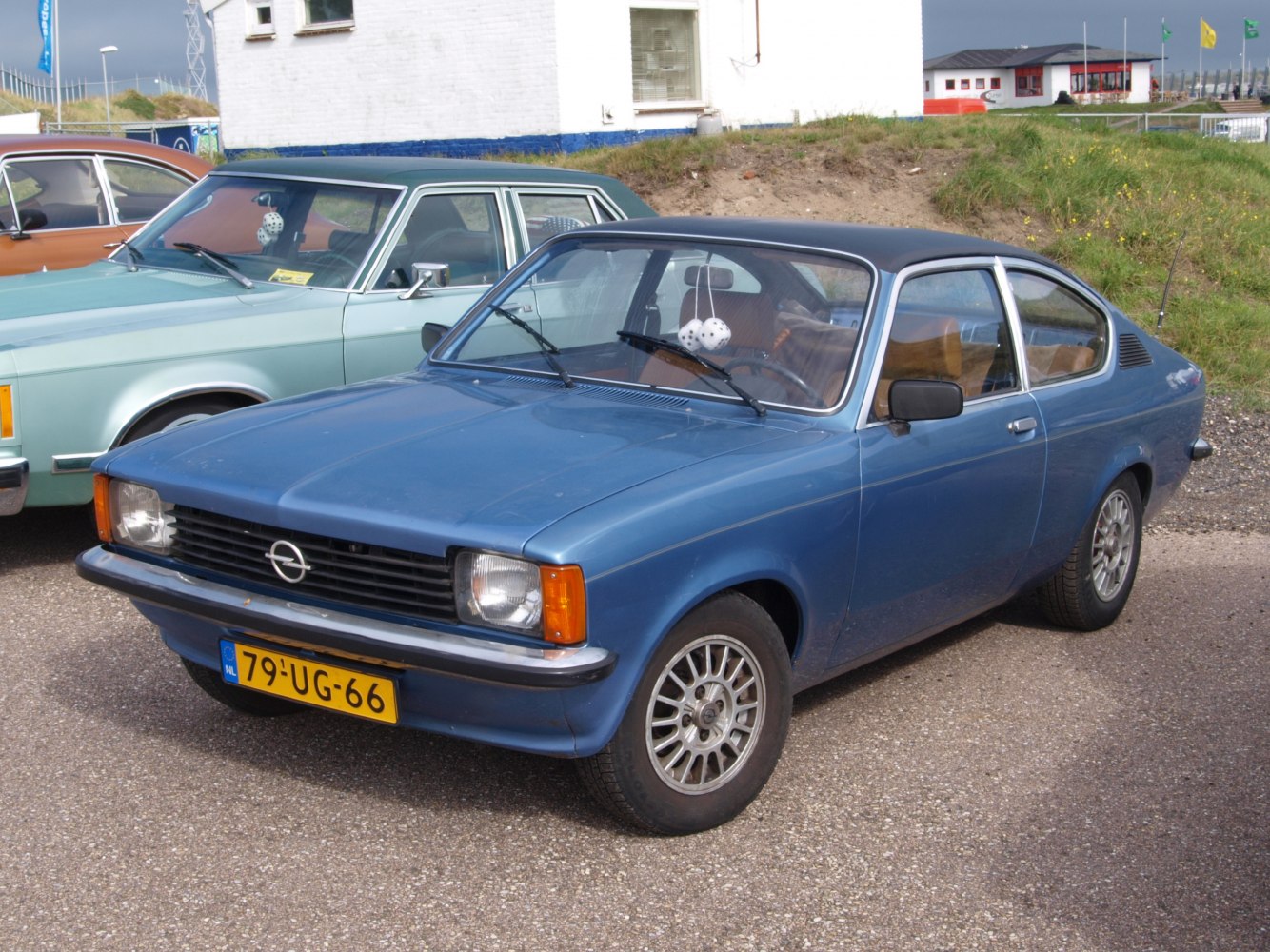 Vintage 1970s two-door compact coupe with steel wheels