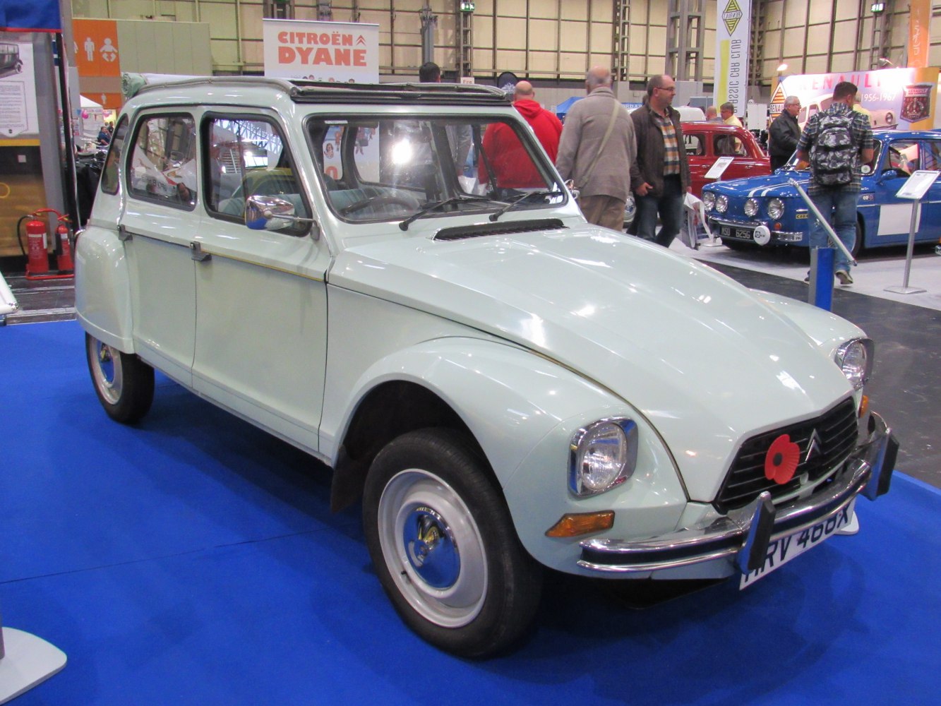 Classic white vintage hatchback with round headlights