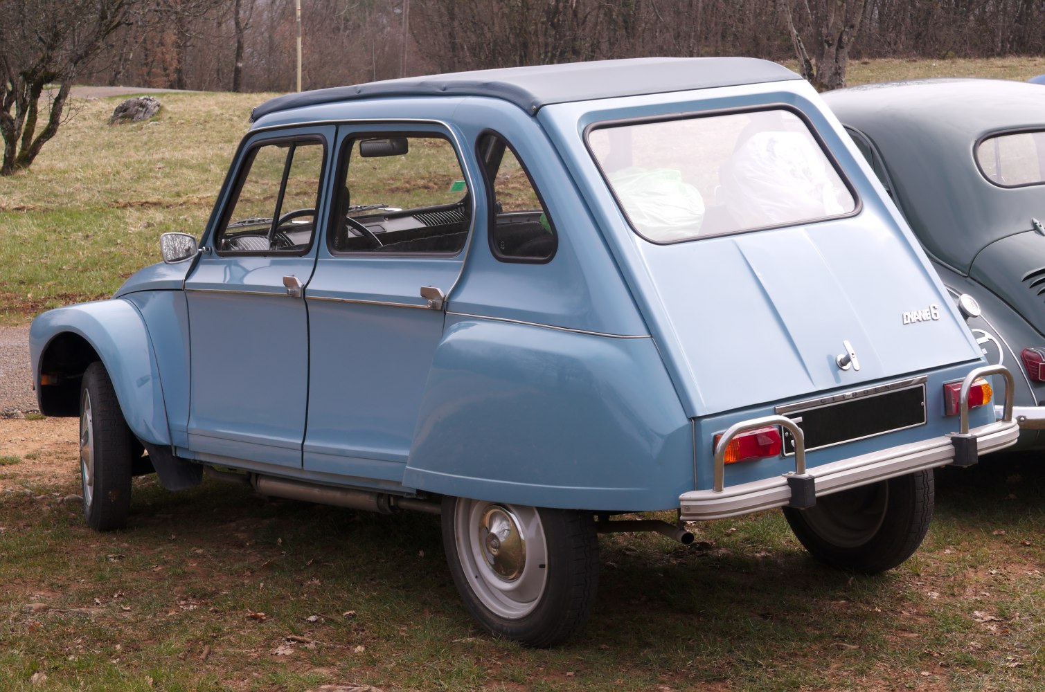 Small hatchback with soft fabric roof and rounded fenders