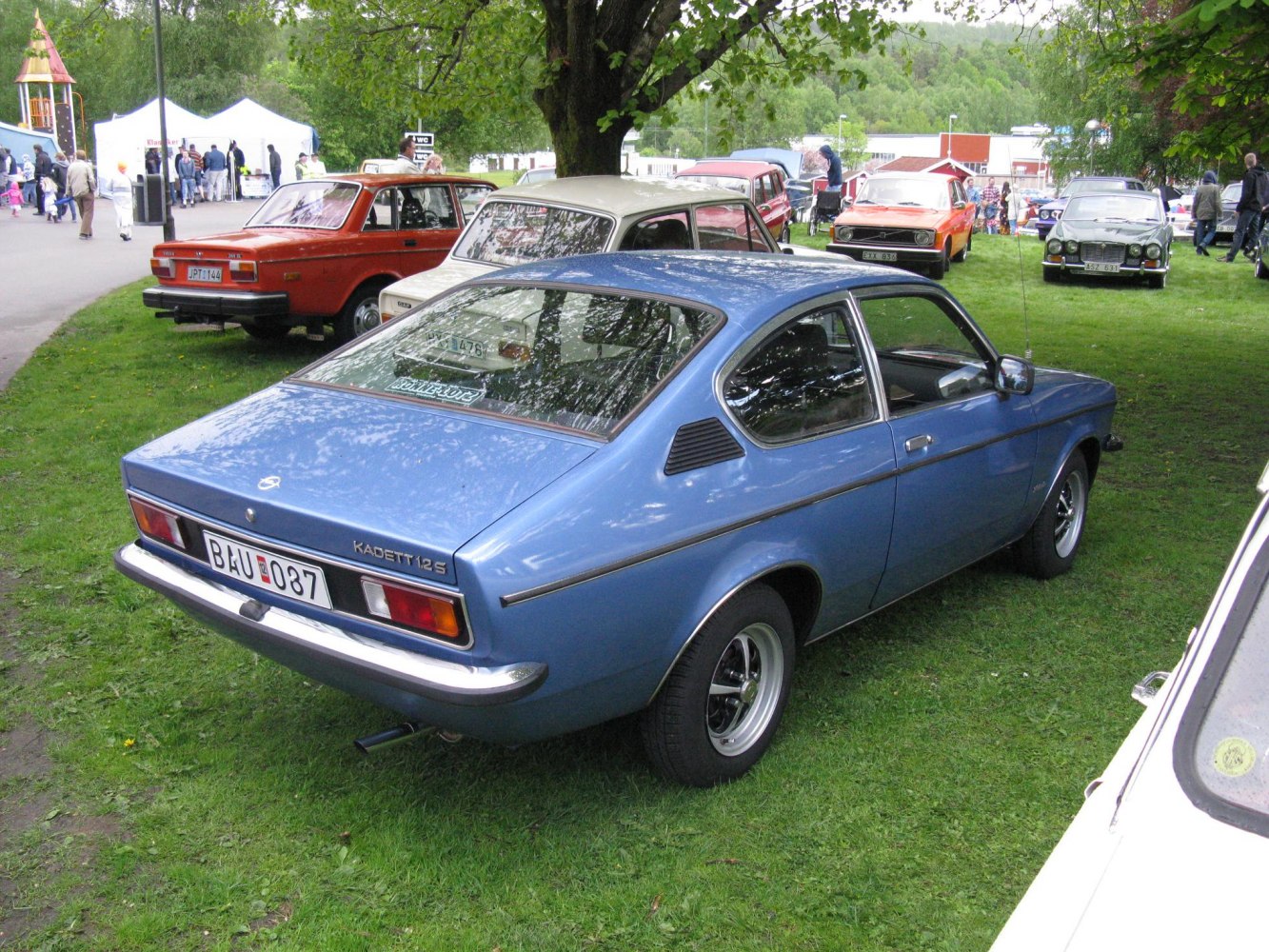 1970s blue coupe with rear louvers and fastback design
