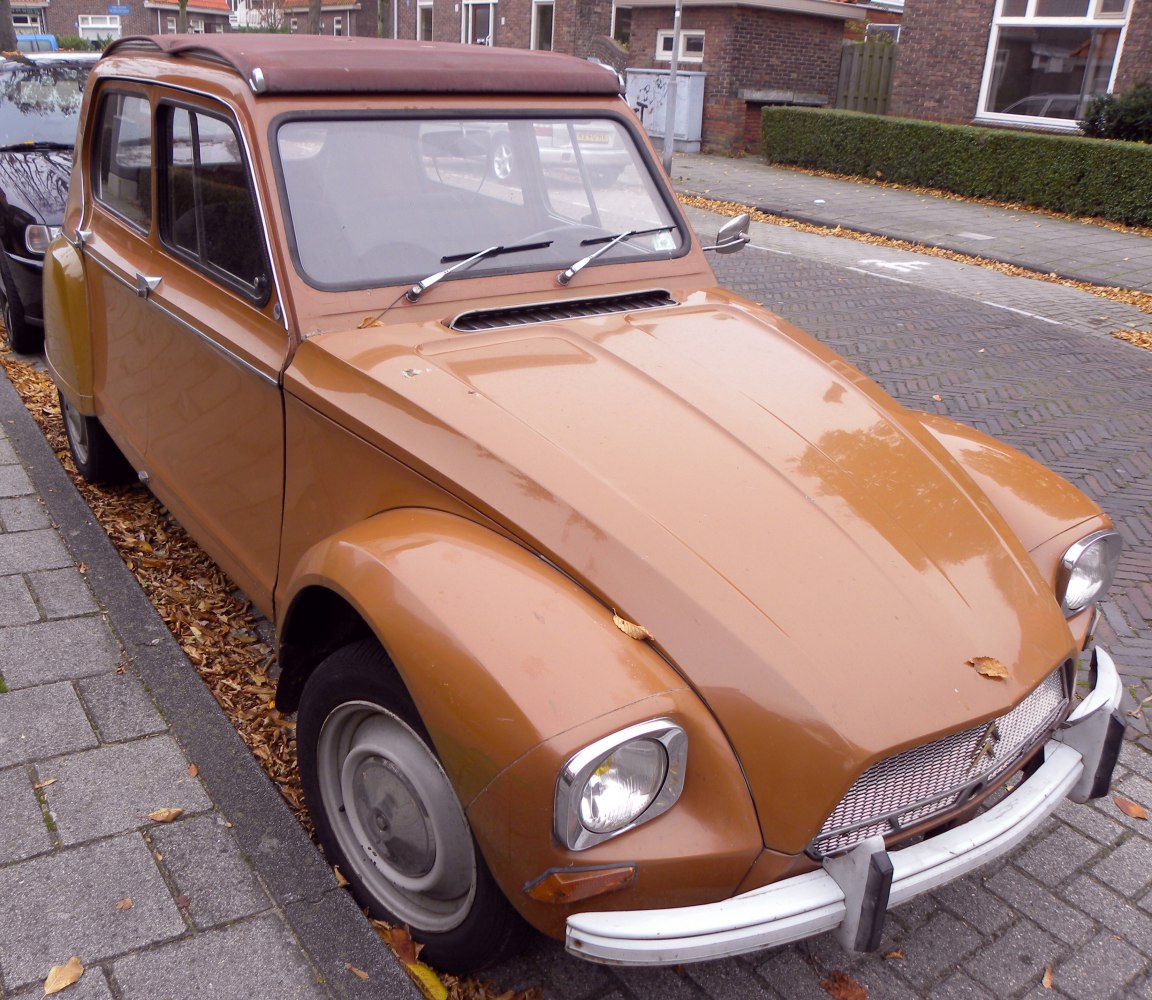 Rounded fenders, soft fabric roof, and classic front grille.