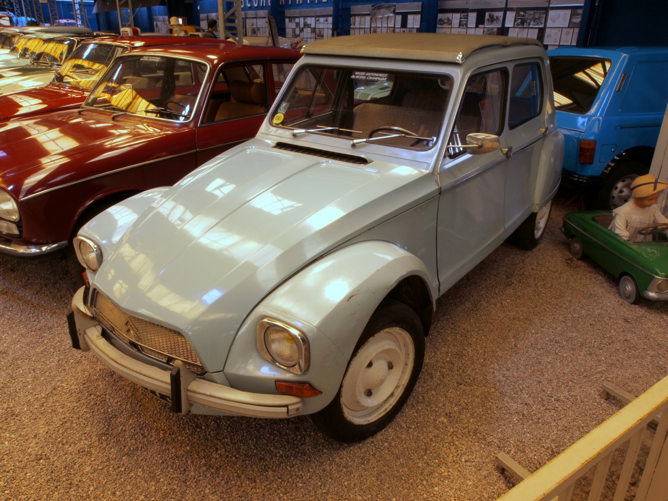 Front view of vintage vehicle with rounded headlights and classic grill