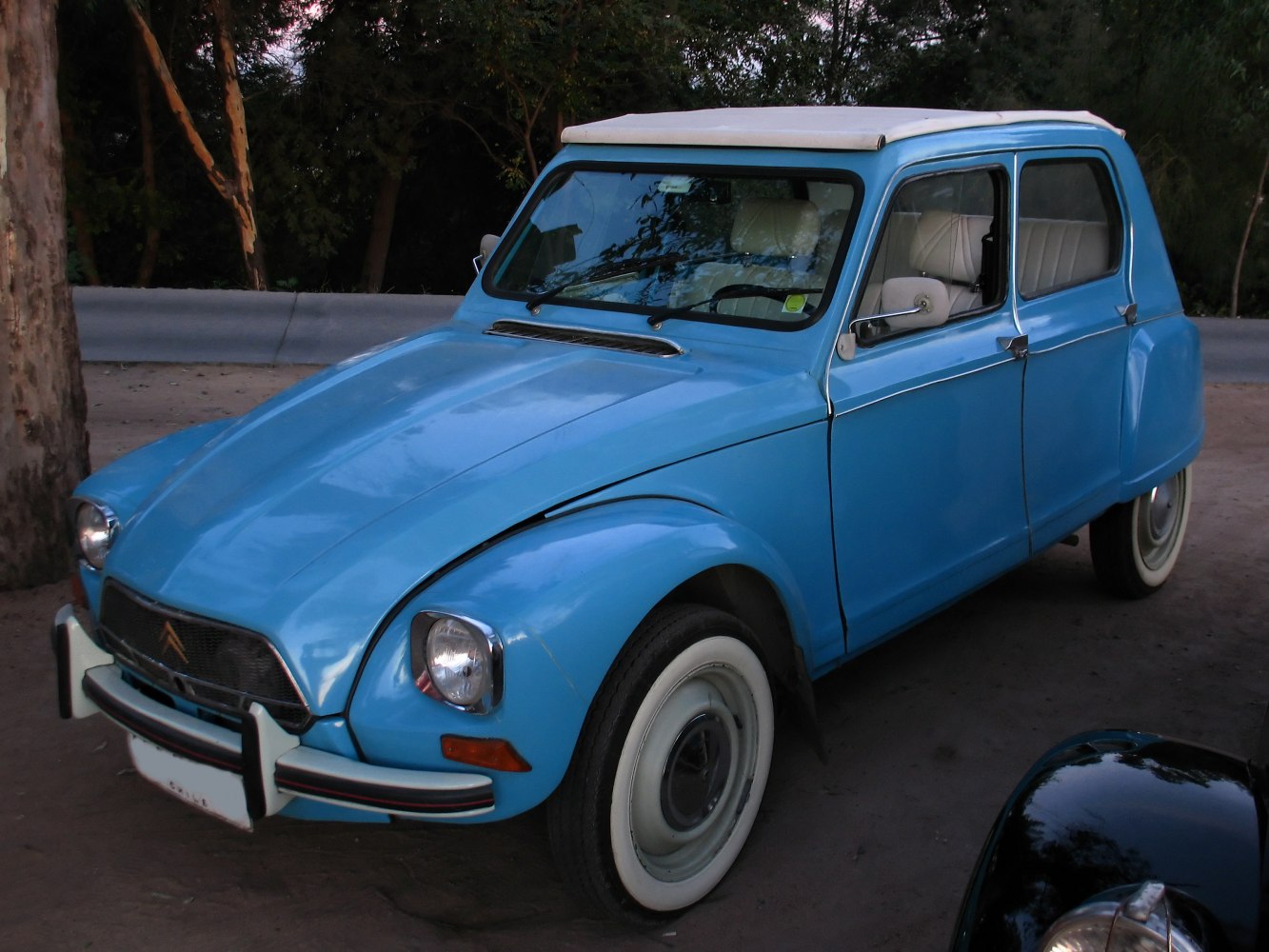 Classic hatchback with rounded headlights and whitewall tires