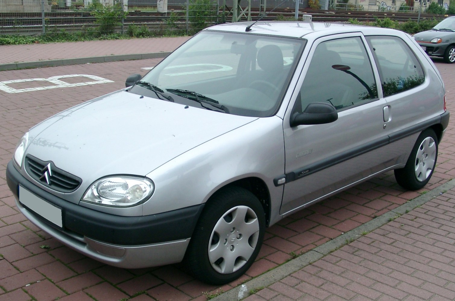 Compact hatchback with rounded headlights and black bumper