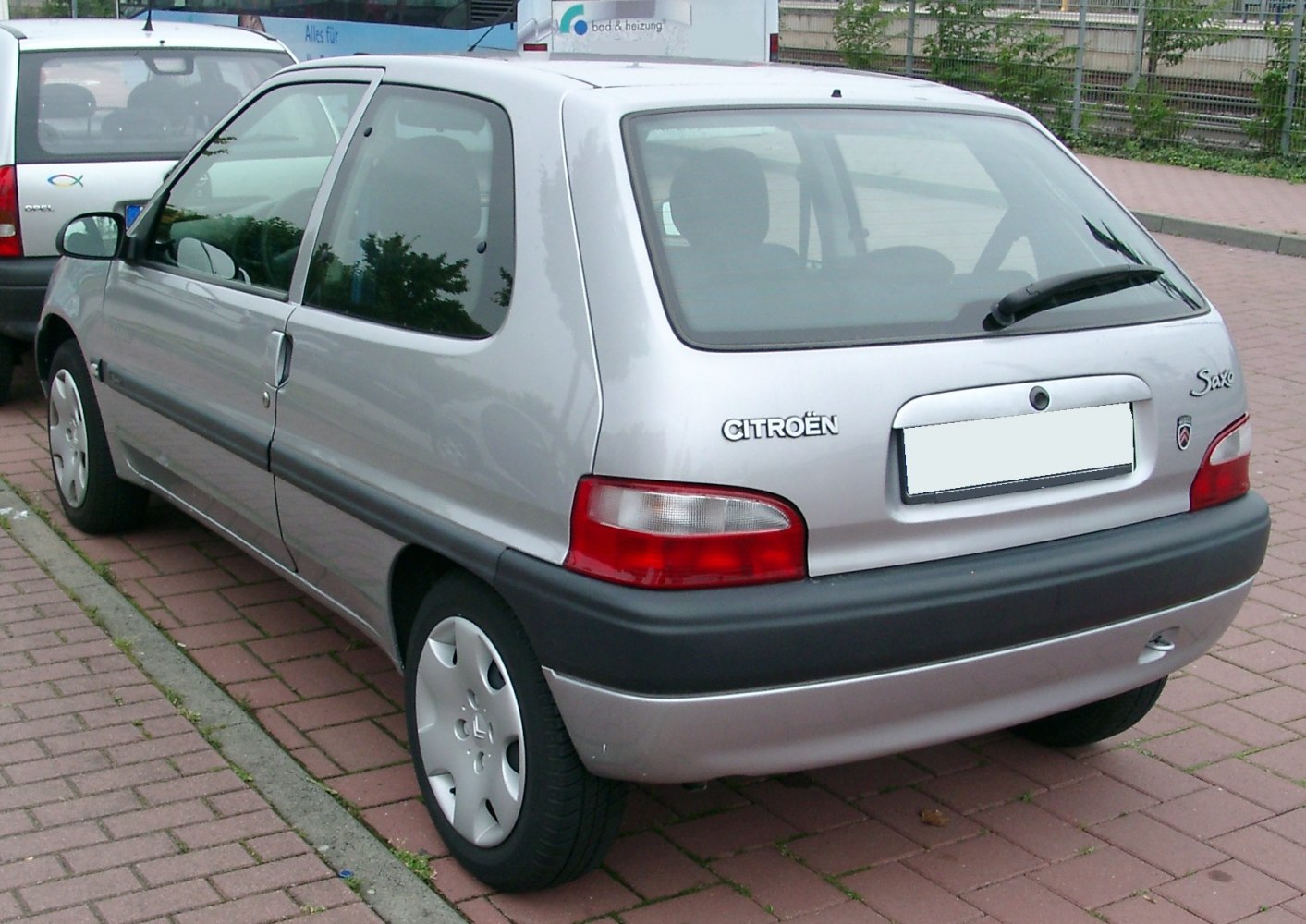 Rear view of 3-door hatchback with distinctive taillights and rear window wiper