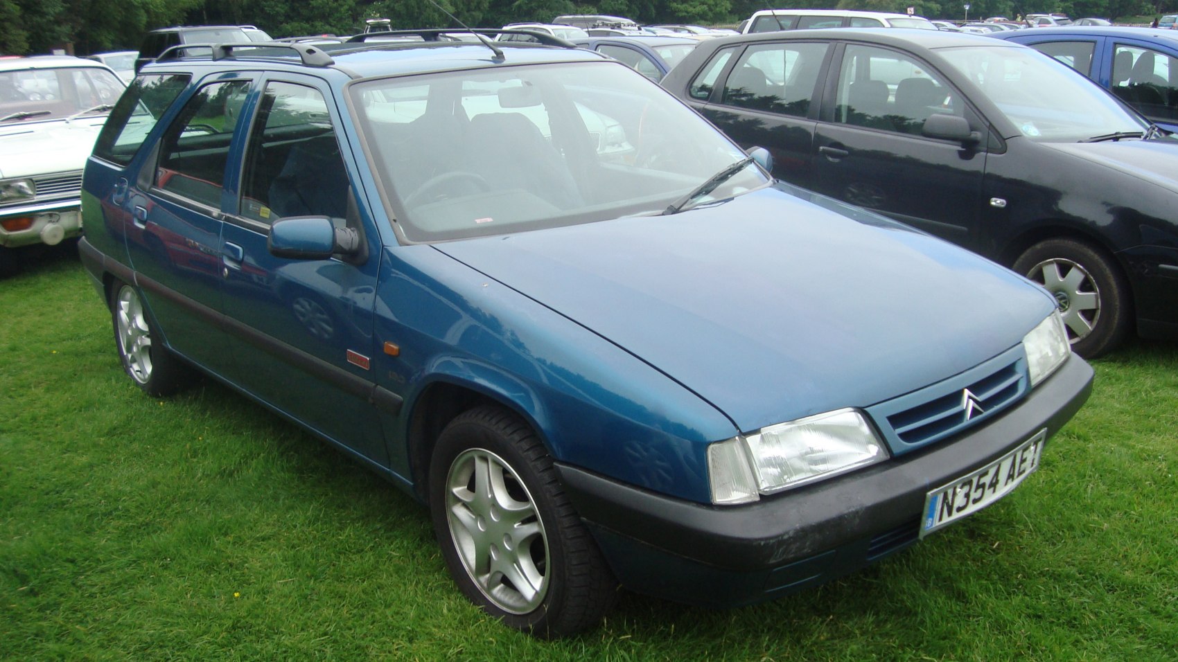 Compact wagon with angular headlights and alloy wheels