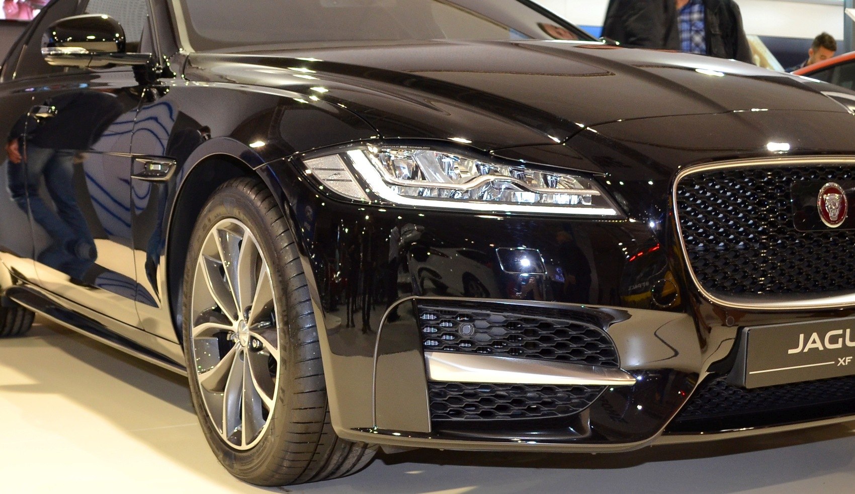 Front headlight and alloy wheel design with glossy black finish.