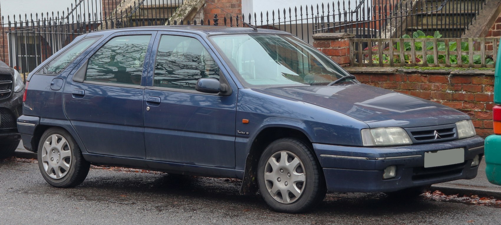 Mid-90s 5-door hatchback with turbo diesel badge and classic compact shape