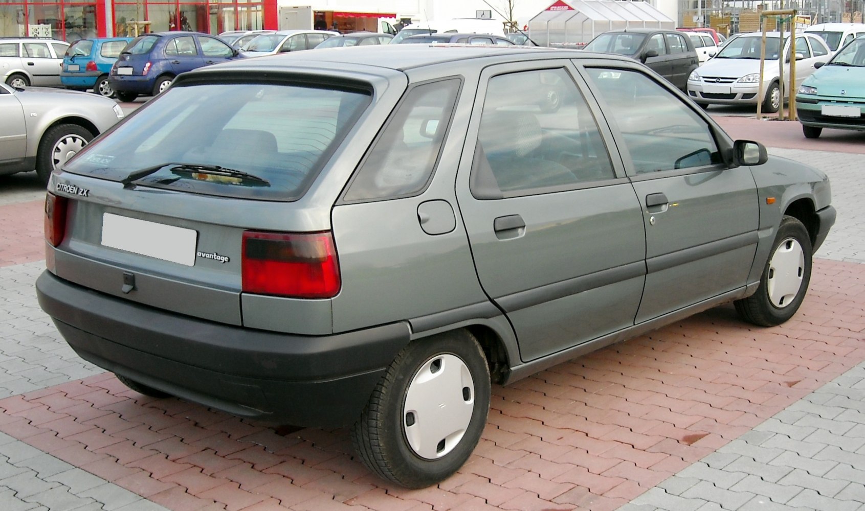 Rear side angle of 5-door hatchback with distinct tail lights and angular body design