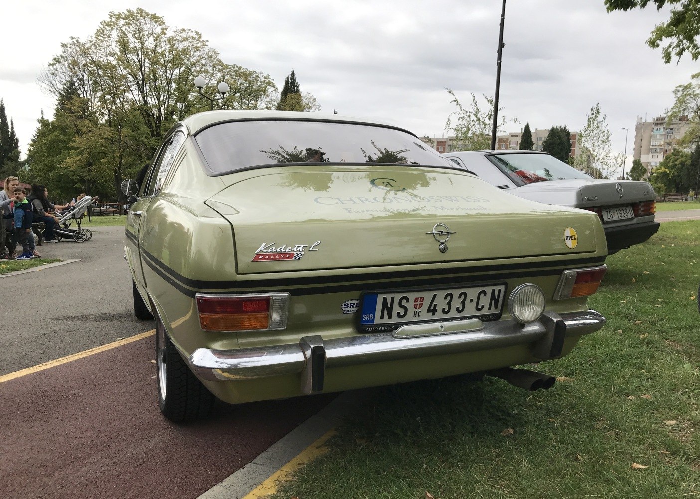 Rear view of a classic coupe with chrome bumper and vintage taillights