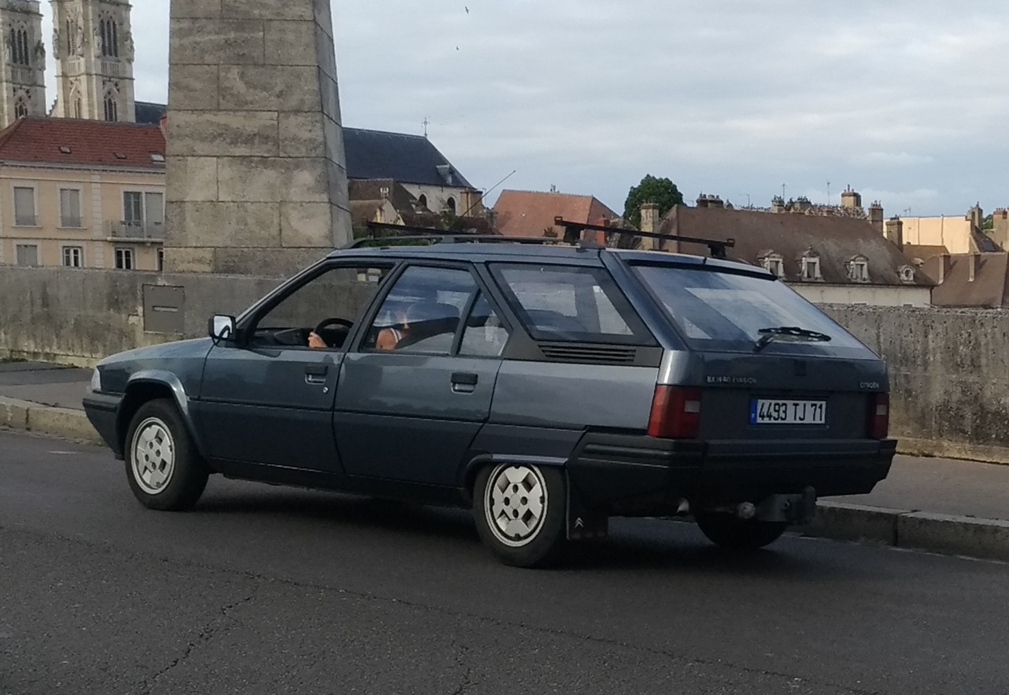 Angular hatchback with roof rack and classic 1980s wheel design