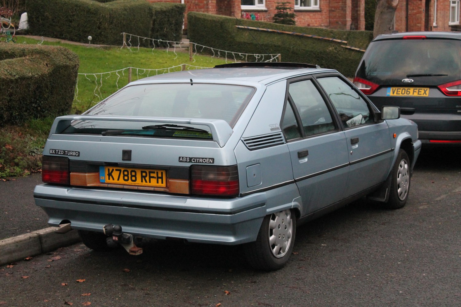Late 1980s hatchback rear with spoiler and tow hitch