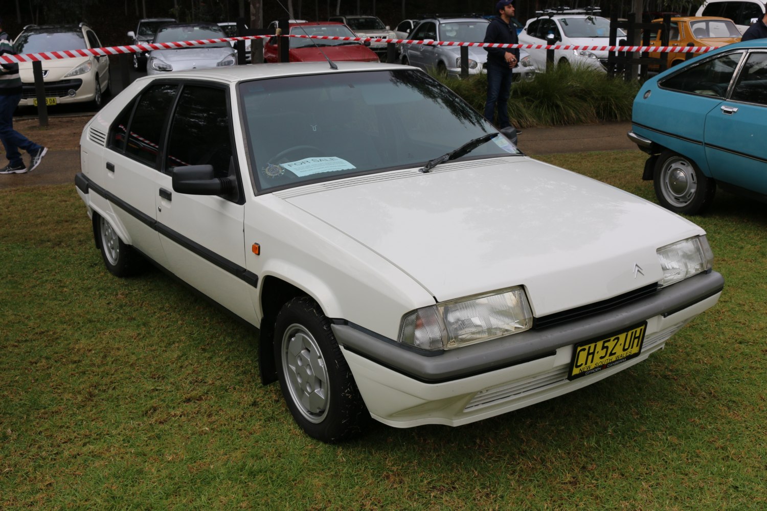 White hatchback with angular front headlights and sharp design lines