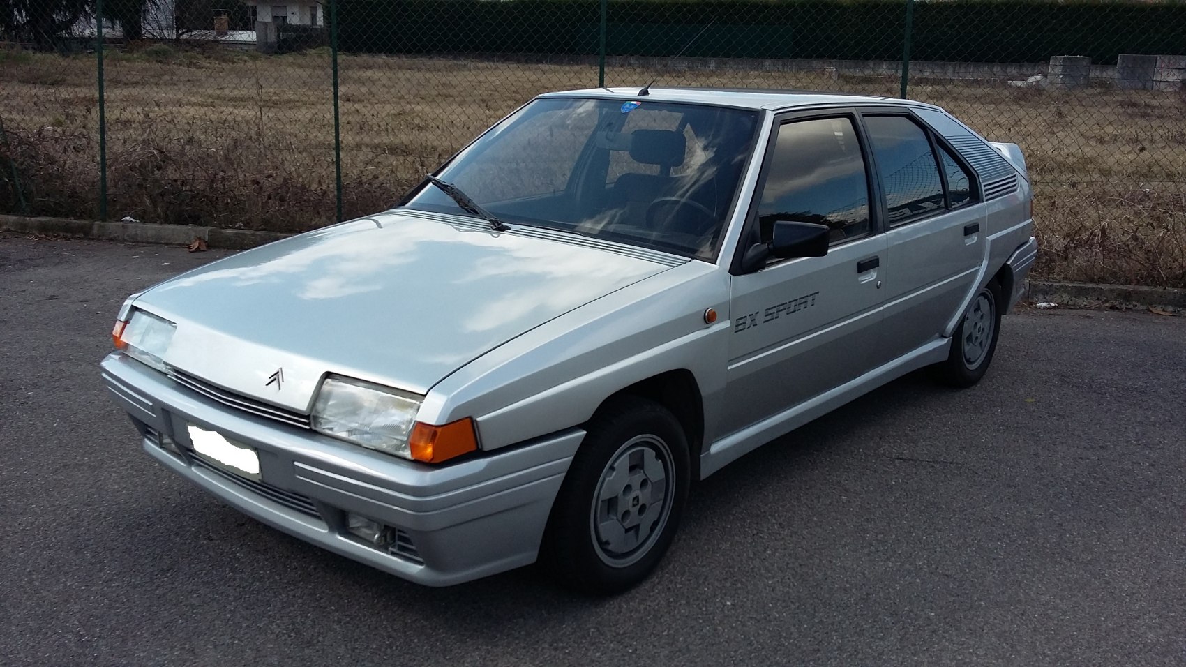 Vintage hatchback with angular body and pop-up headlights