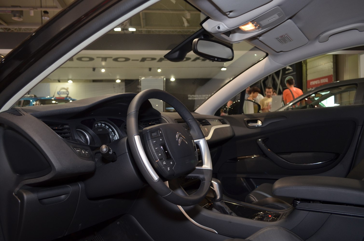 Dashboard view with steering wheel and front cabin interior