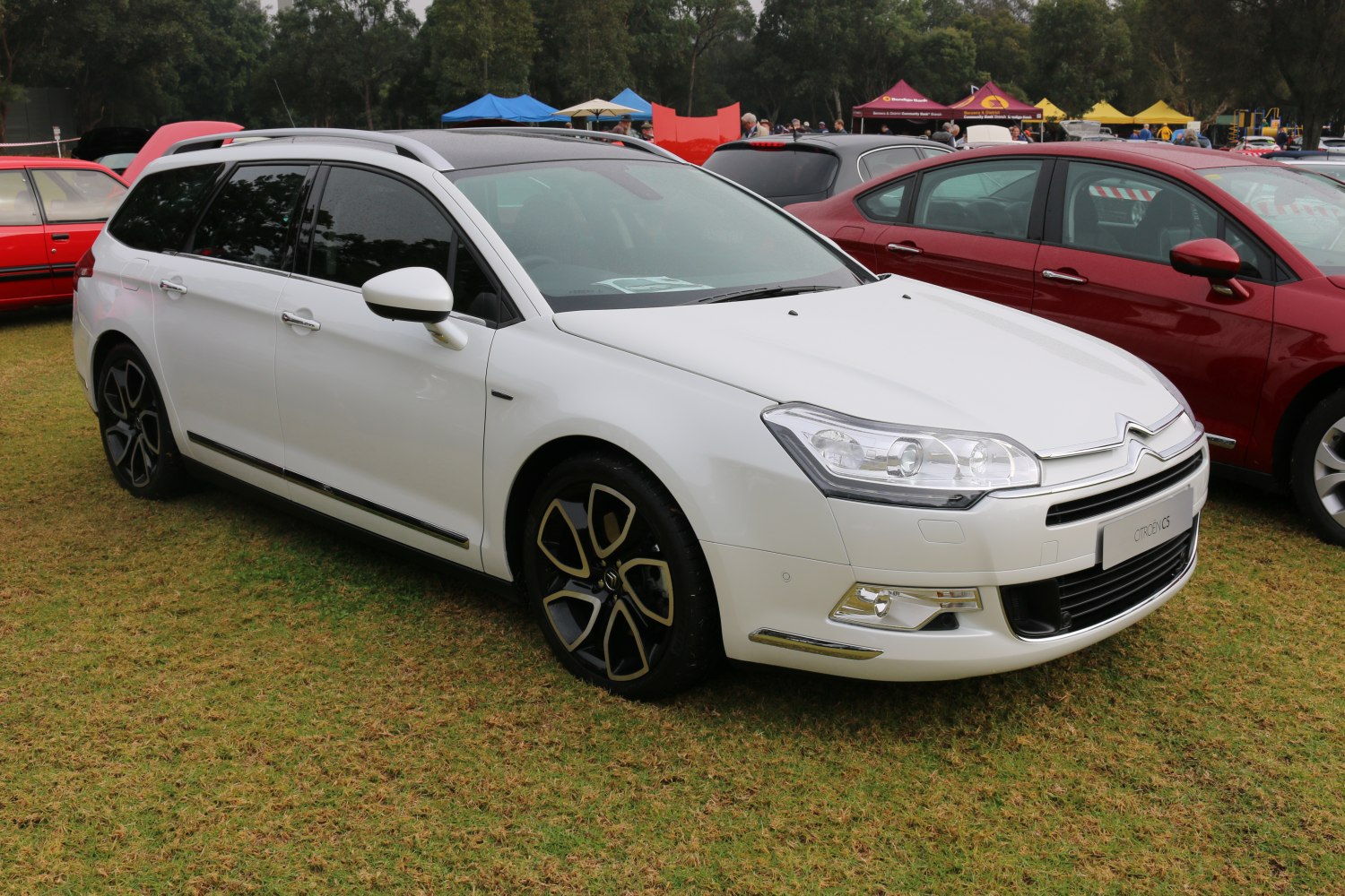 Modern white station wagon with alloy wheels and aerodynamic design