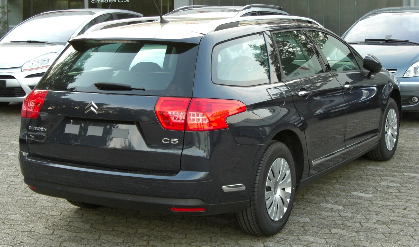 Rear view of station wagon with distinct tail lights and hatchback design