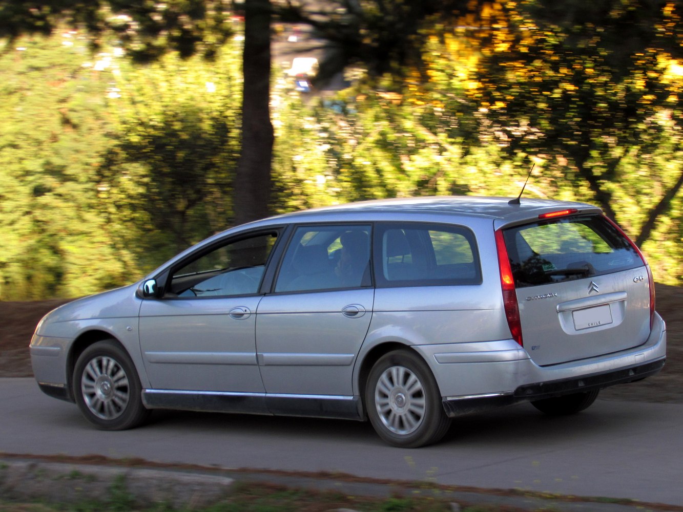 Side profile of silver station wagon with extended rear design