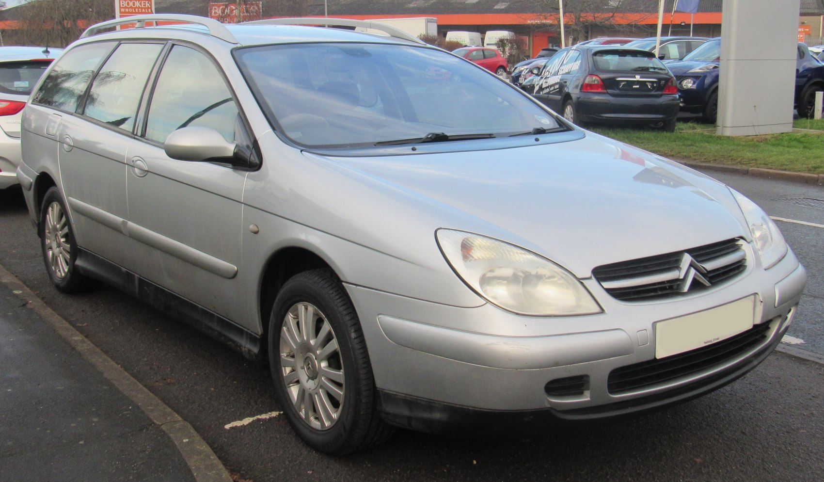 Front side view with headlights and alloy wheels