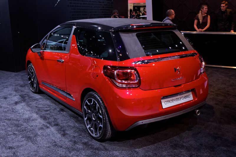 Rear view of compact hatchback with distinctive taillights and black roof