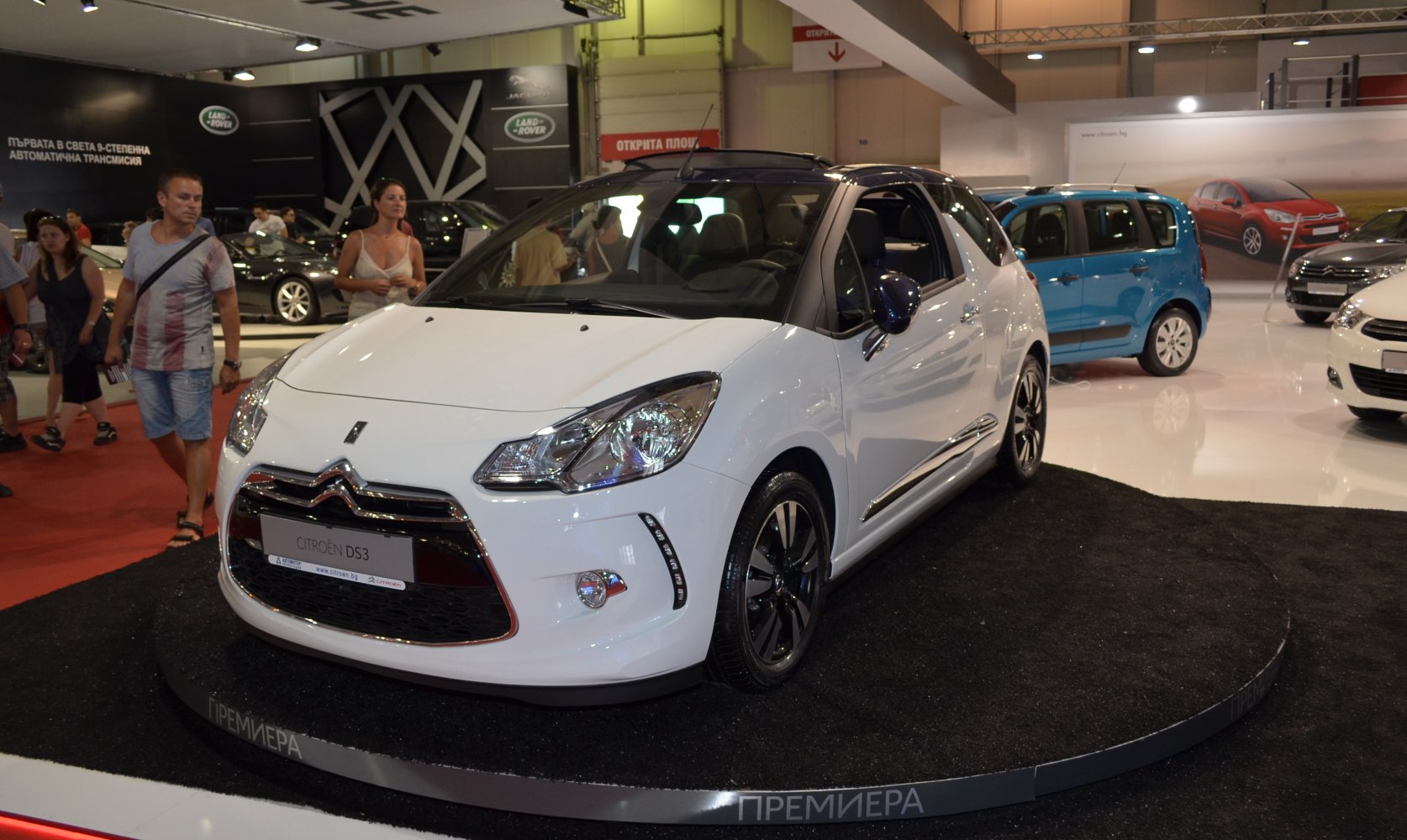 Front view of a hatchback with LED daytime running lights and black alloy wheels