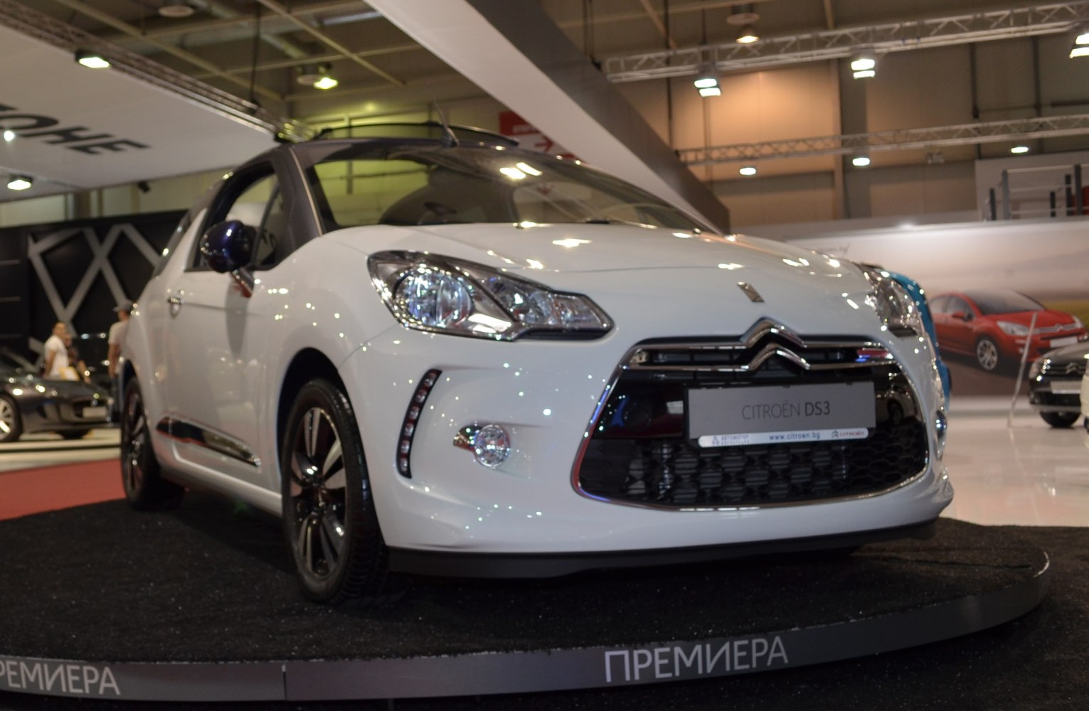 Front view showing headlights, grille, and alloy wheels of a compact hatchback