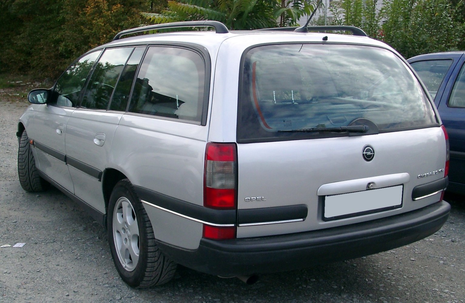 Silver station wagon rear with roof rails and taillights