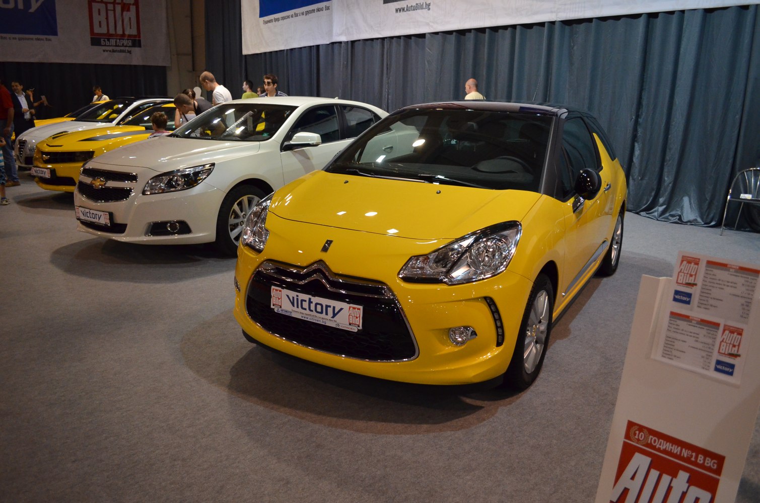 Yellow hatchback with black roof and distinctive grille