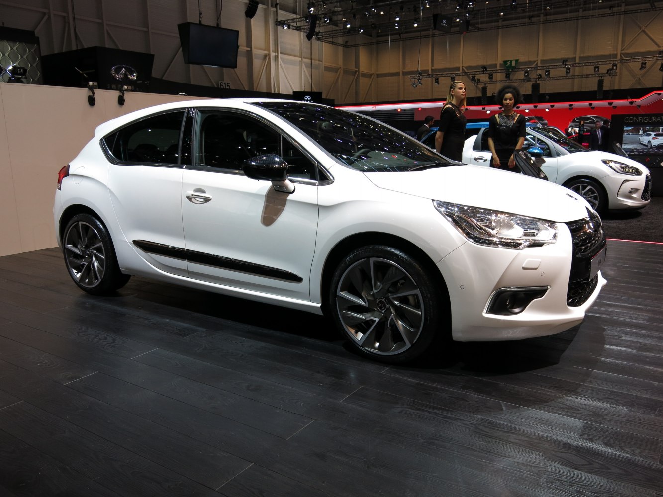 White hatchback with alloy wheels and aerodynamic side profile