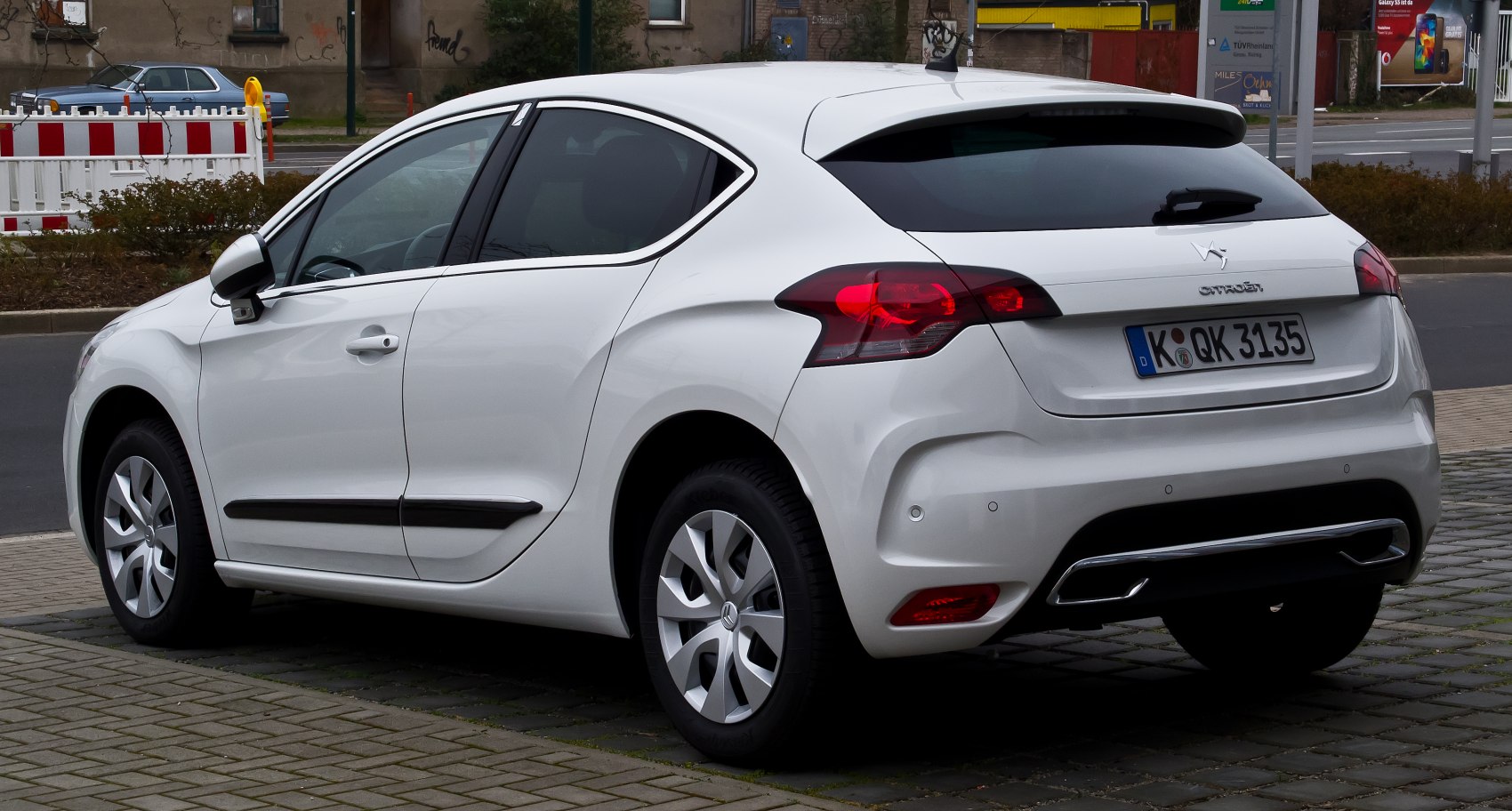 Rear side view with unique taillights and hatchback profile