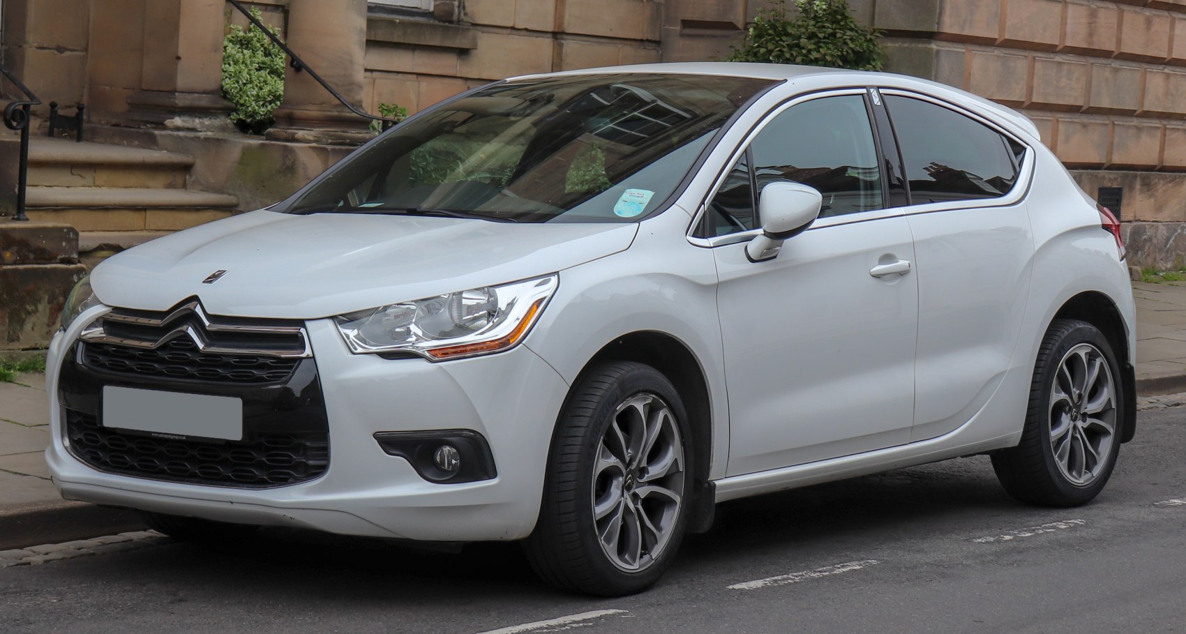 Front side profile with distinctive headlights and aerodynamic design