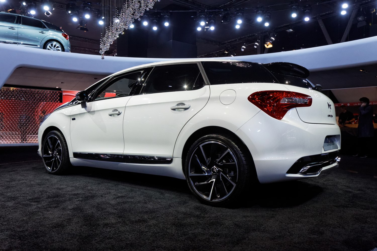 White hatchback with black roof and alloy wheels