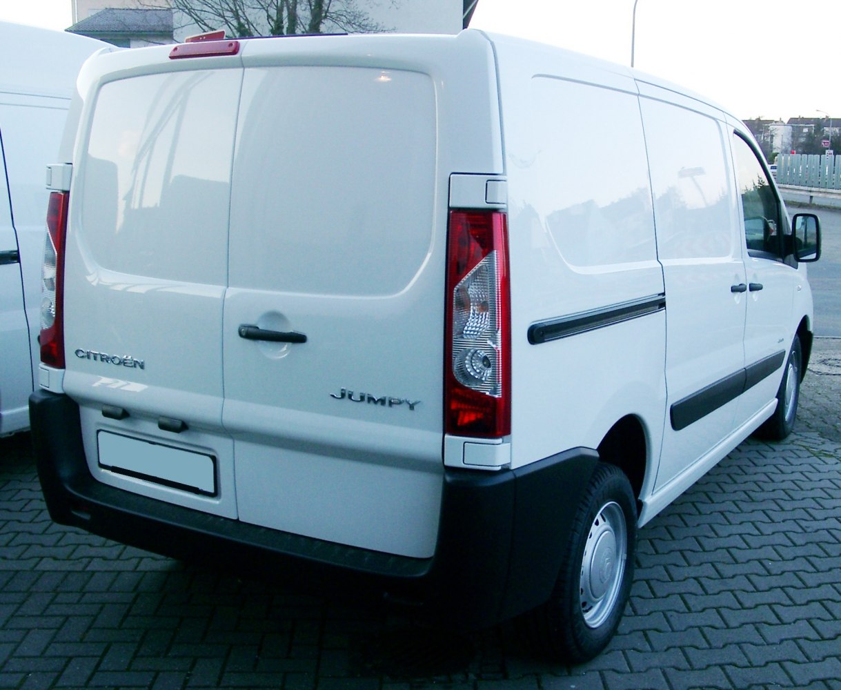 Rear and side view of commercial van with dual rear doors and sliding side door