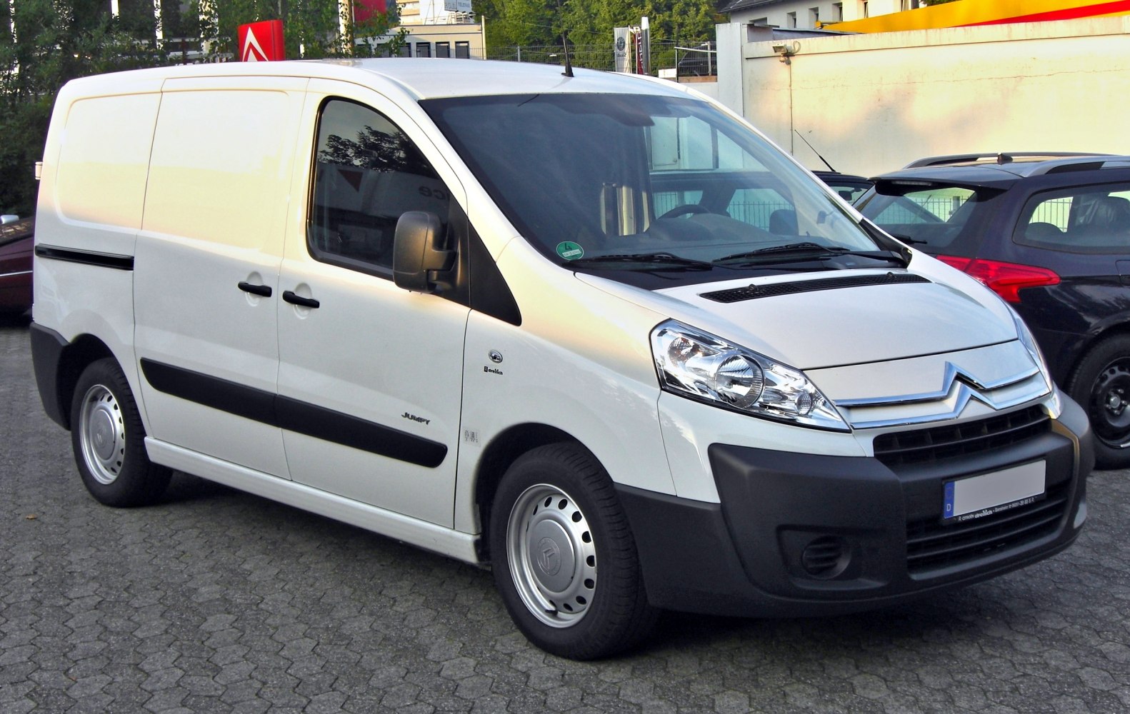 White cargo van with front side view and black bumpers