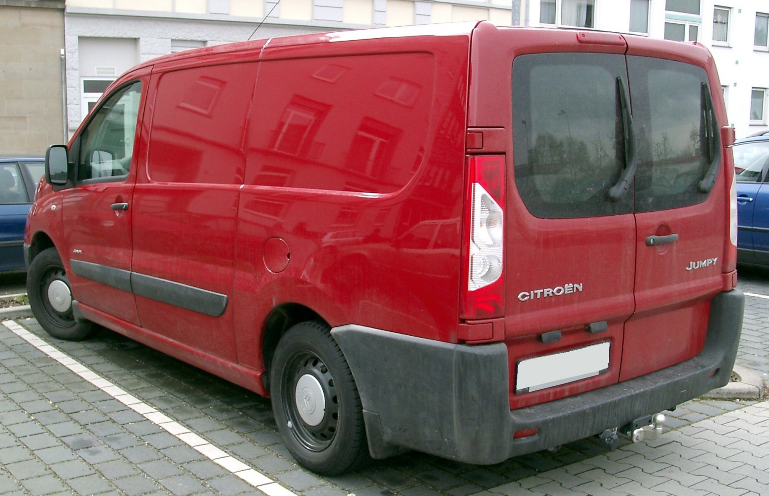 Red cargo van with boxy shape and dual rear doors