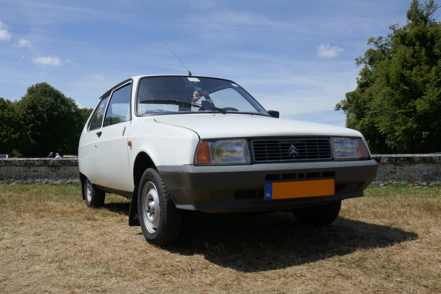 Classic 1980s white hatchback with distinct front design and rectangular headlights