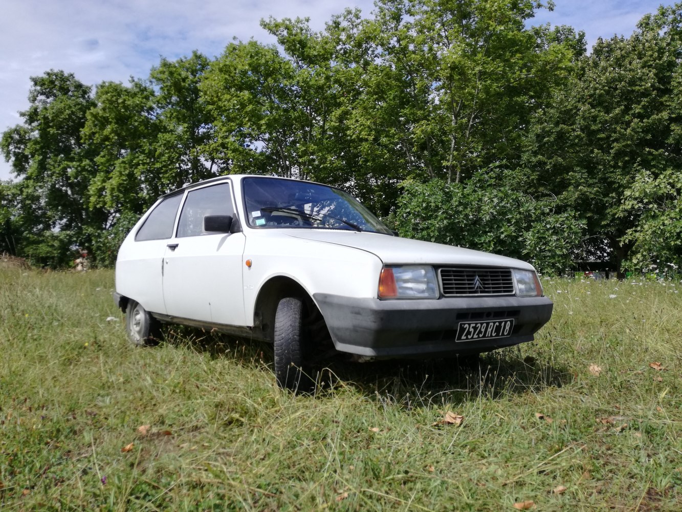 Classic 1980s compact hatchback with rectangular headlights and simple grille