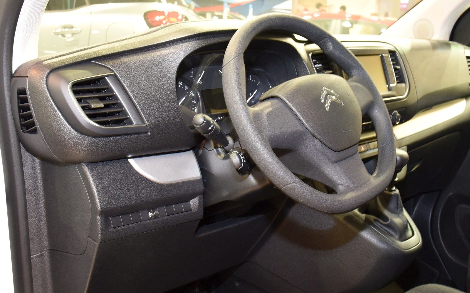 Steering wheel and dashboard with digital display and air vents