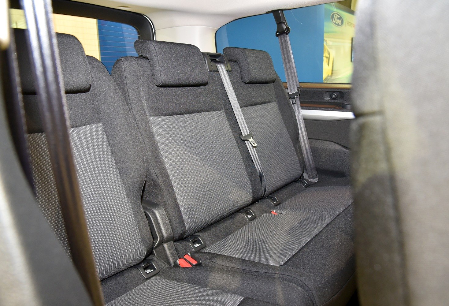 Spacious rear fabric seats with headrests and seat belts
