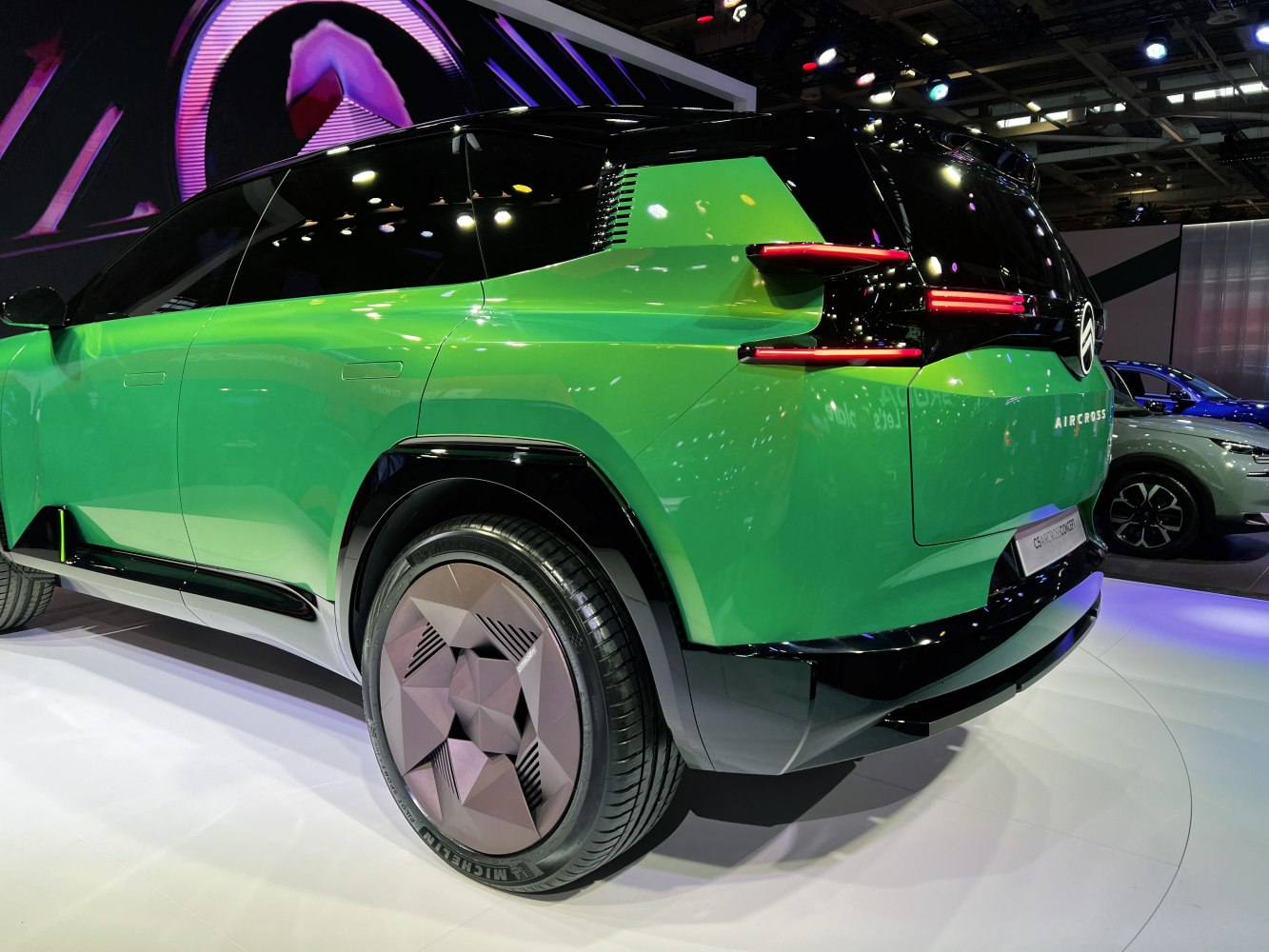 Futuristic rear design with distinct vertical tail lights and geometric wheels